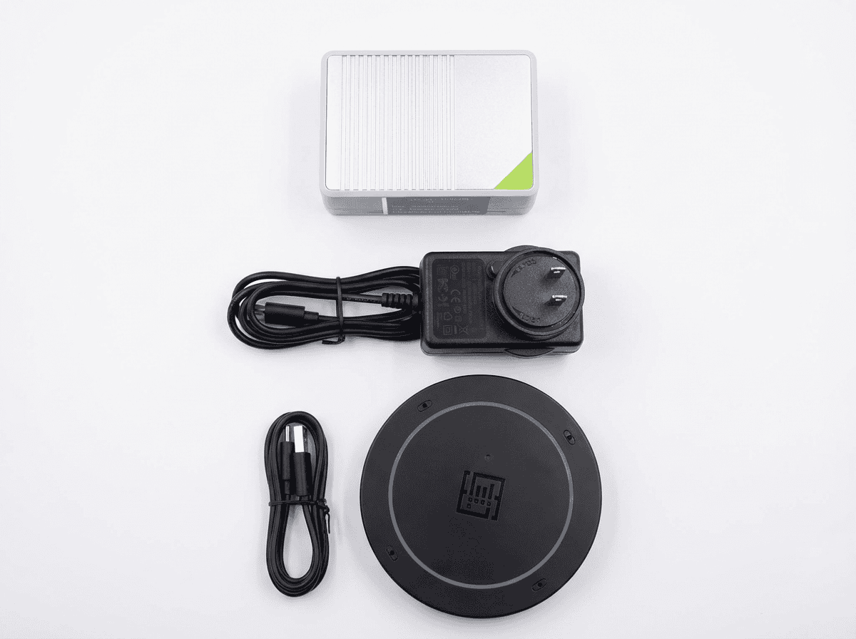 The capture kit as it ships — a reRouter CM4, its power supply, a USB cable and a reSpeaker XVF3800 microphone array